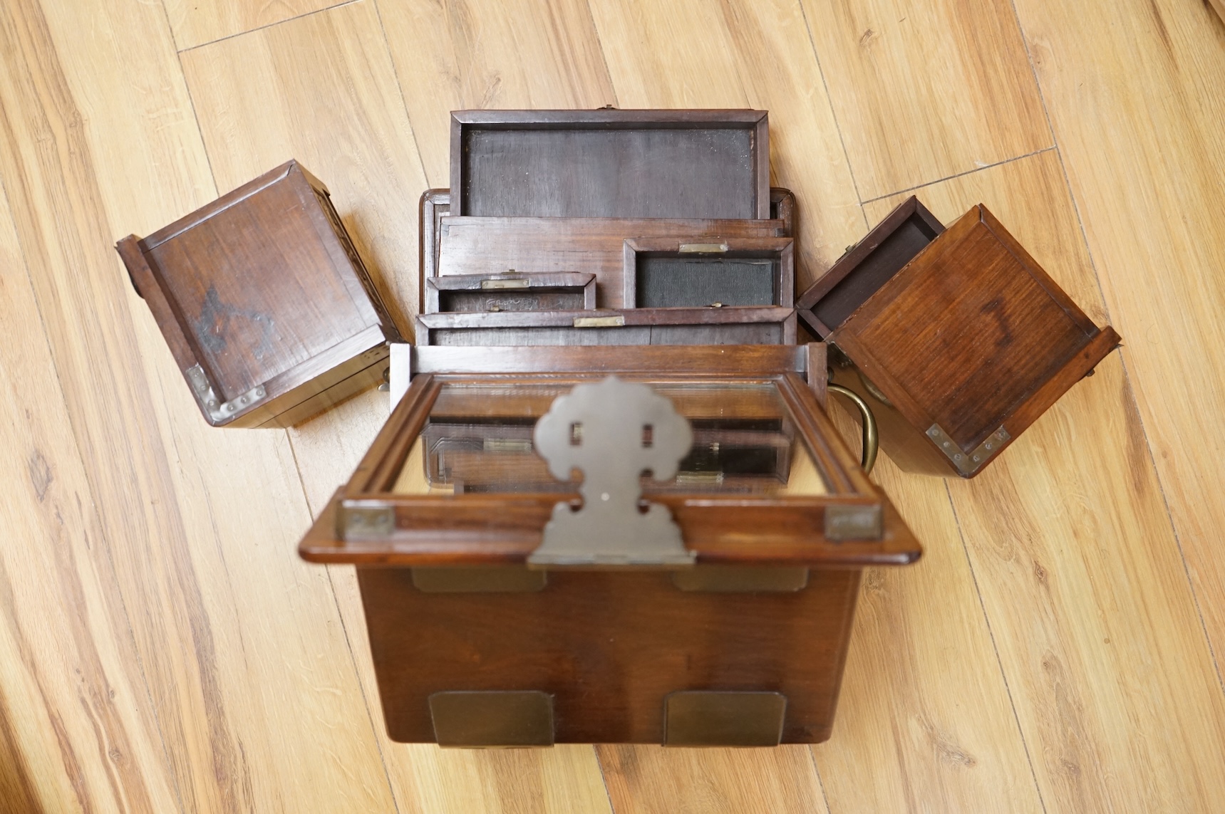 A Chinese rosewood brass bound dressing chest, closed 39cm deep, 29cm wide, 23cm high.
